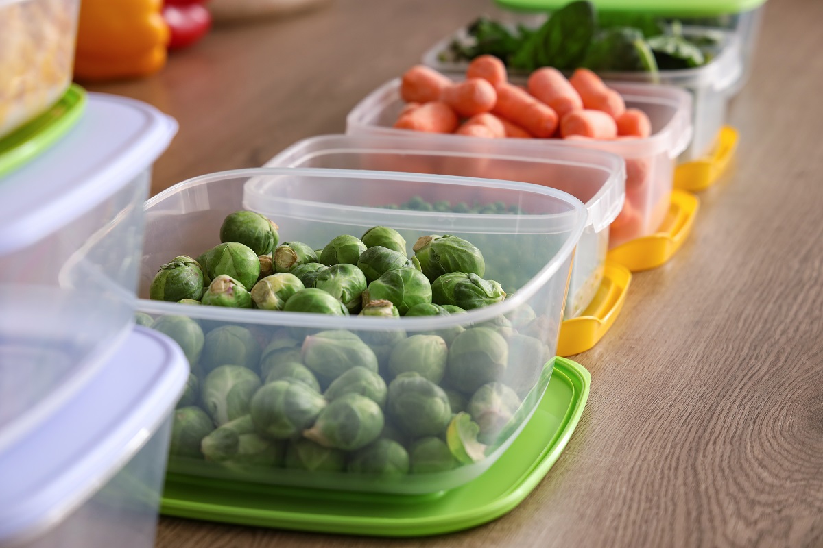 Plastic,Containers,With,Vegetables,For,Freezing,On,Wooden,Table,,Closeup